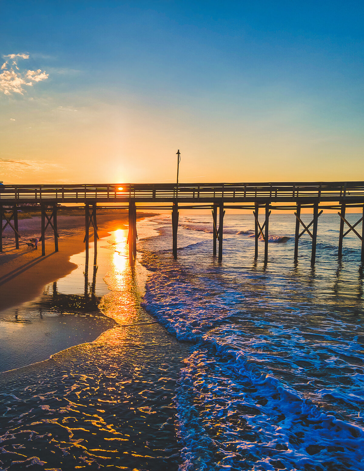 Sunrise Waves Beneath the Pier