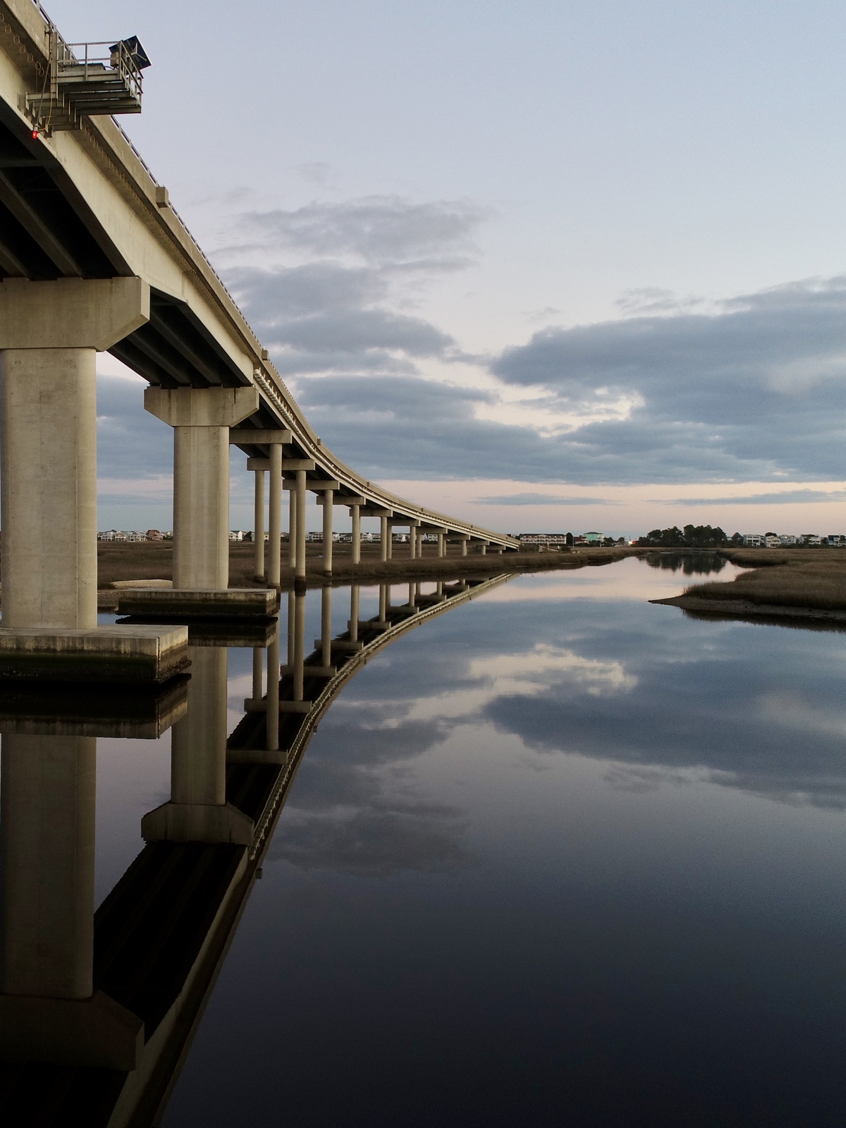 Aerial View of a Coastal Bridge at Dusk
