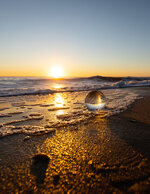 Glass Orb in the Surf