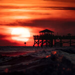 Crimson Sunset at the Pier